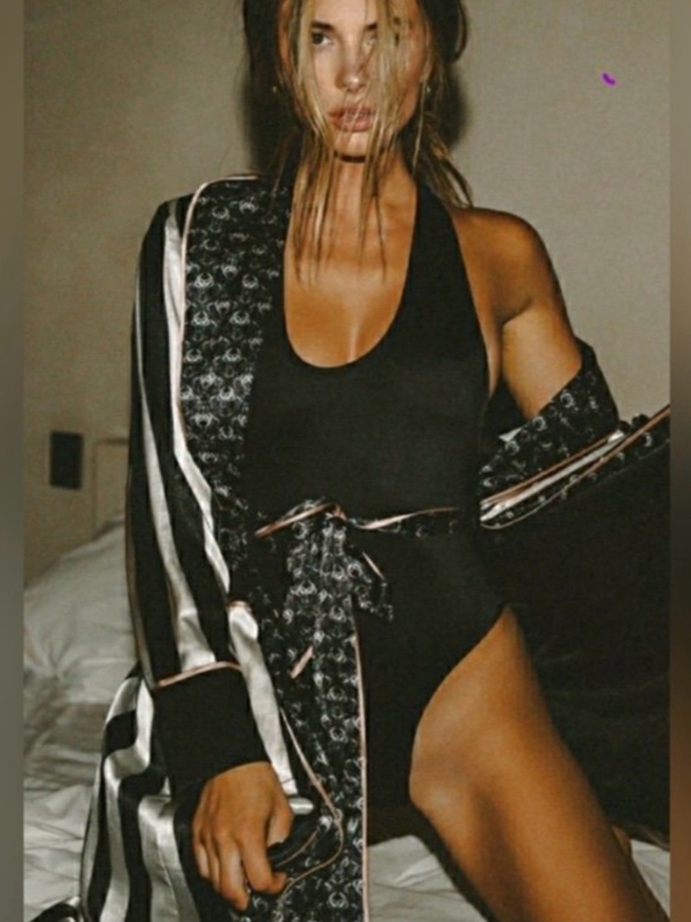 Statement wrap dress by We Are HAH in a bold black, ivory, and charcoal